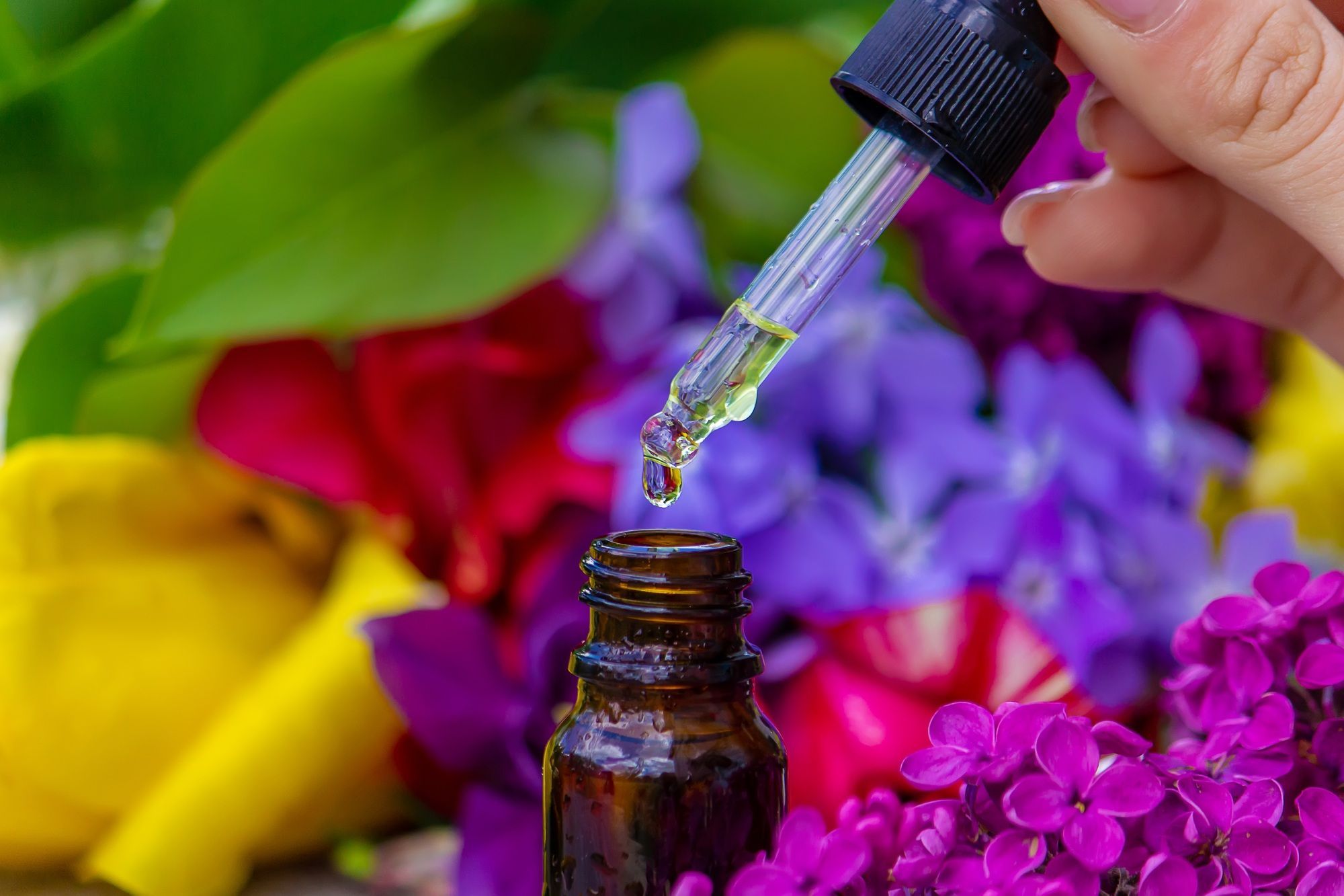 Flower Buzz Collection Flower essential oil. Lilac essential oil in a bottle.
